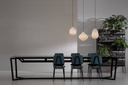 CIRCUS pendant light by Curarto in dining room above long table with six chairs at the sides